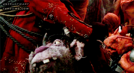 A gif set featuring Clueless Morgan 'fanboying' over Long John Silver, with the help of Polly Lobster, in the 1996 film "Muppet Treasure Island".