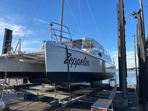 Full transformation hull wrap and custom boat name for catamaran Zeppelin