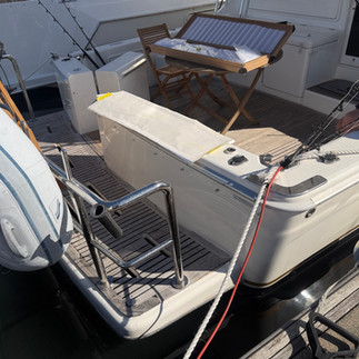 Custom non-LED stainless steel marine lettering in Parisienne font fitted to a Riviera 38 yacht.