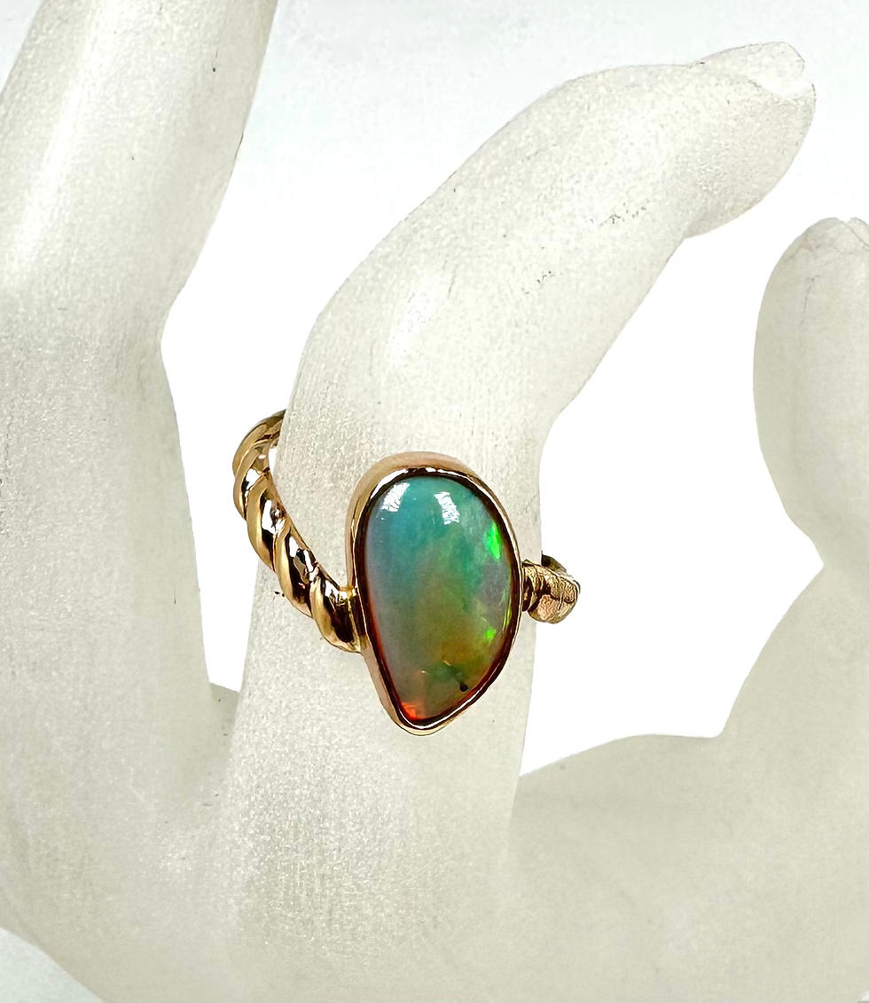 Thumbnail: Ethiopian opal set in a carved gold band