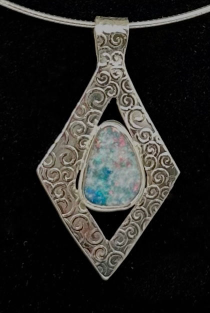 Thumbnail: Pale blue opal in a tiny swirl base