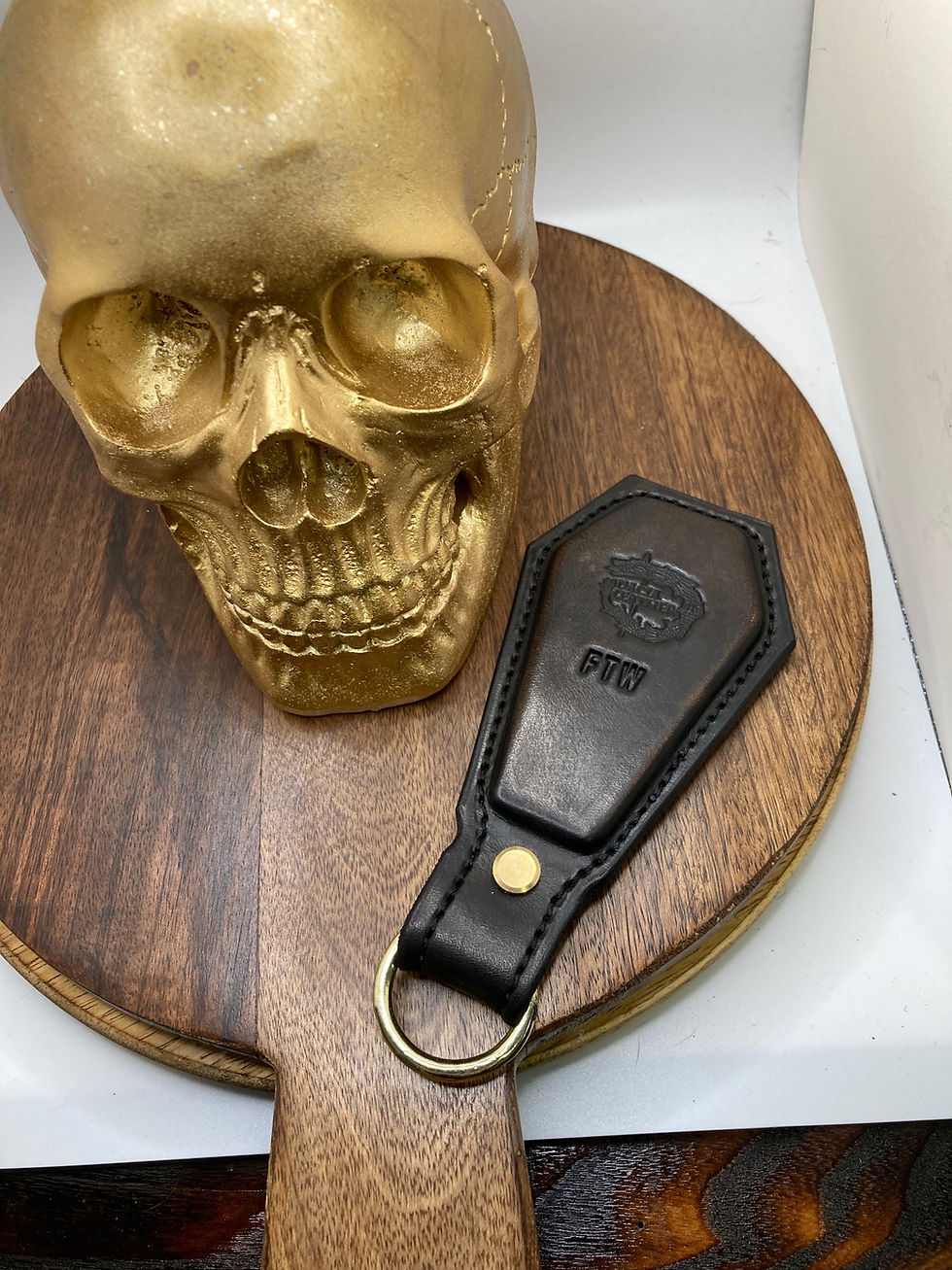 Thumbnail: Steel casket wrapped in black leather keychain, FTW initials, front sided view