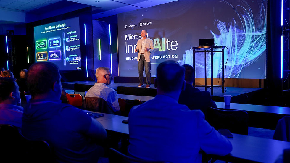 Keynote speaker on stage in morning session with audience looking on