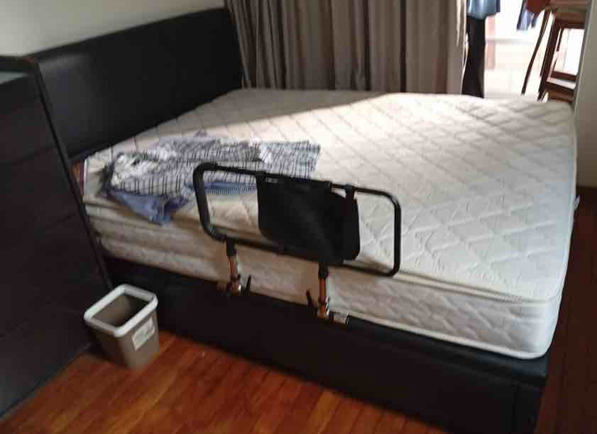 Fast Paid Disposal SG dismantling and removing a bulky storage bed from a condominium in Singapore using appropriate condo access and removal arrangements.