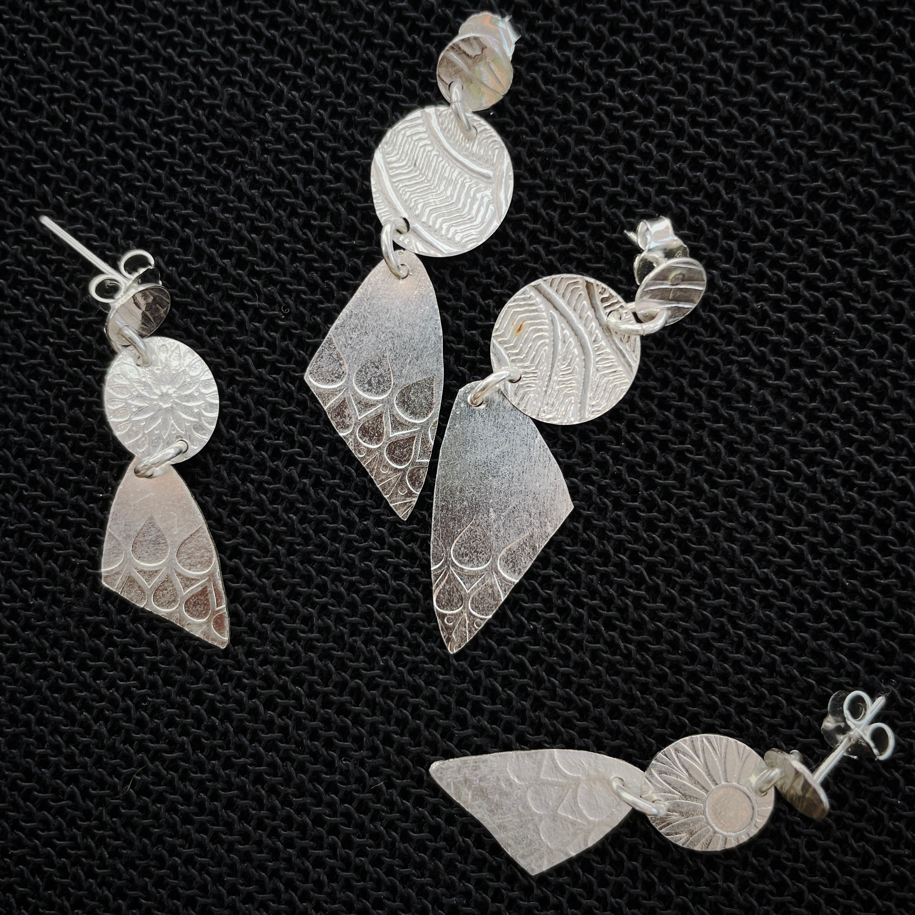 Pressed silver dangles ER