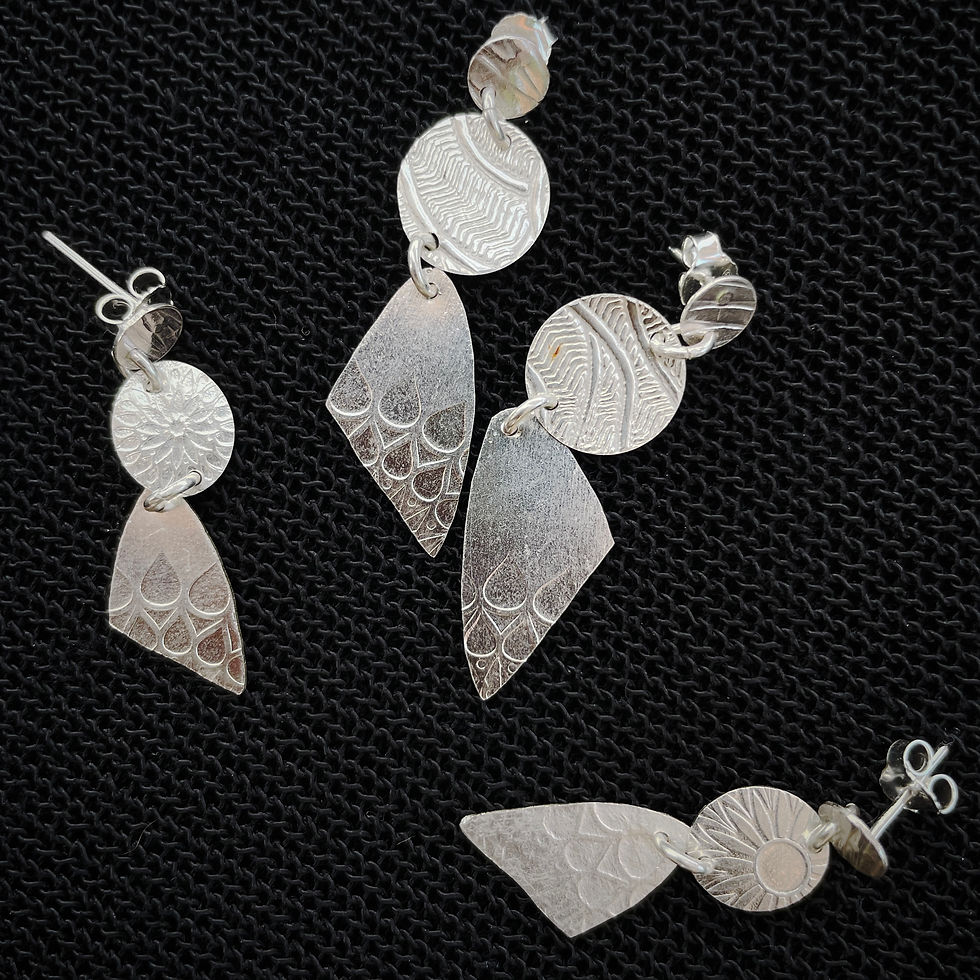 Pressed silver dangles ER
