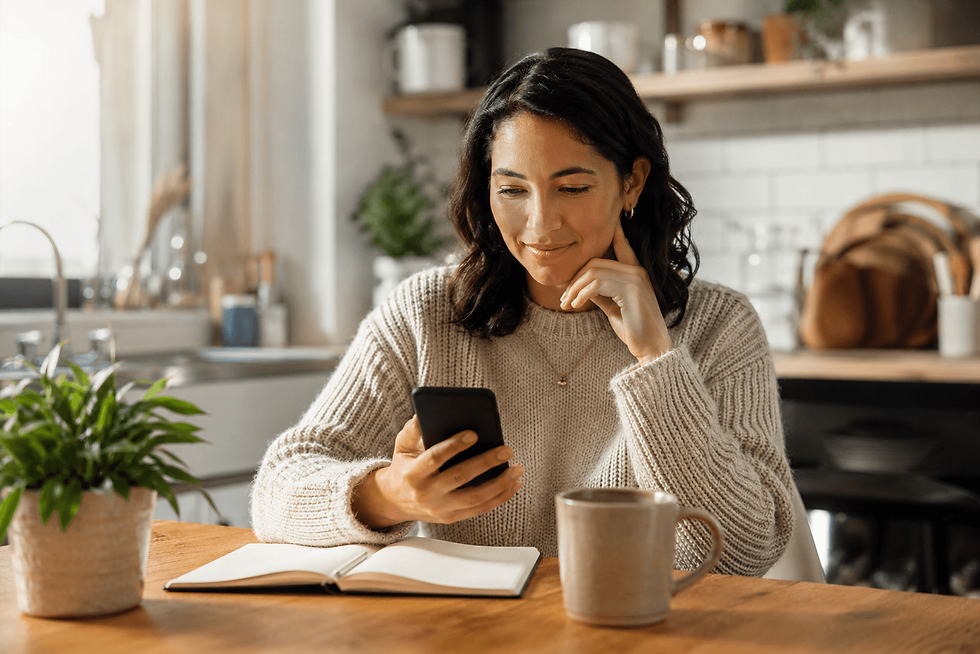 Woman reviewing bad credit loan Canada options on her phone at home