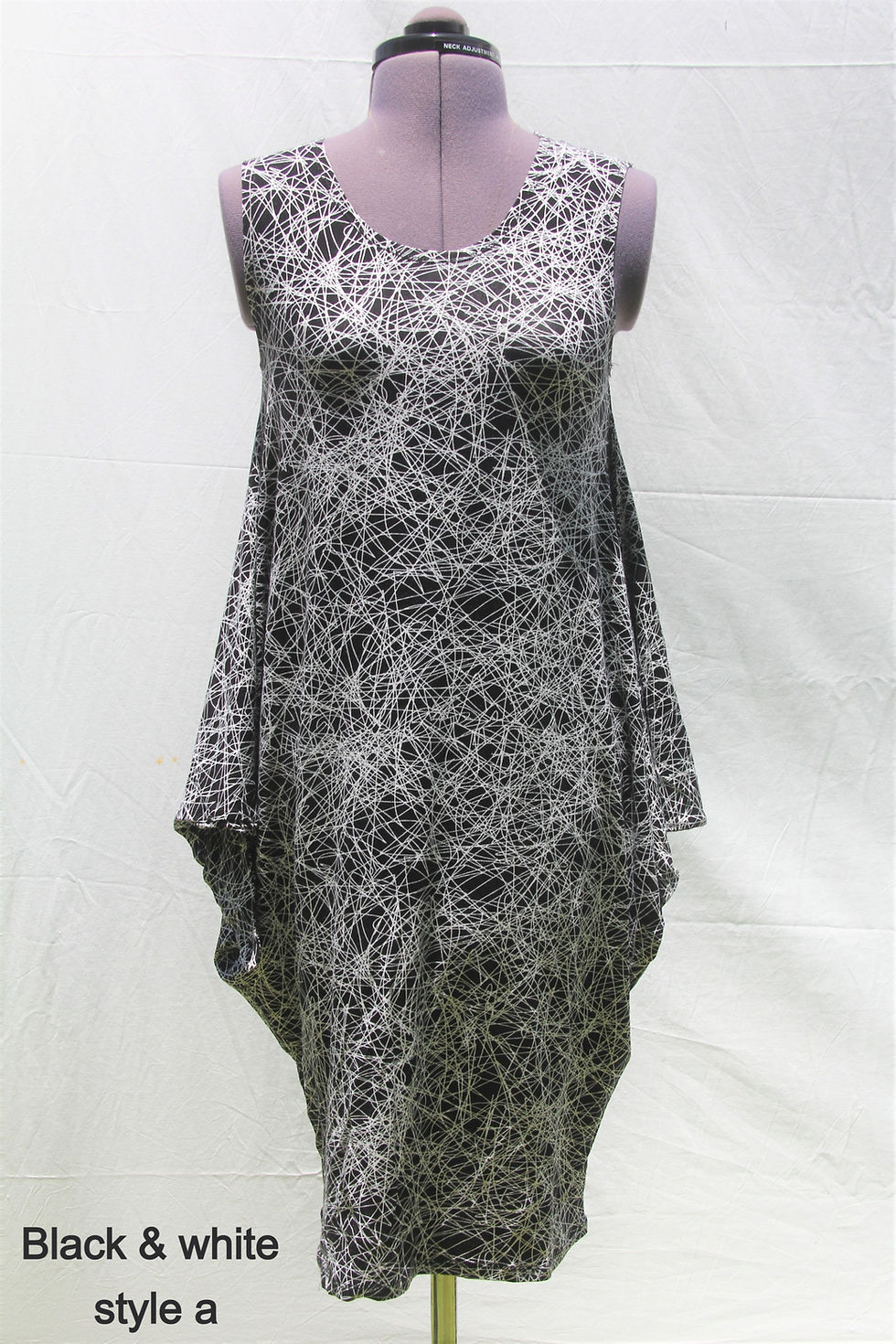 Thumbnail: front view of black & white flowy dress by Chameleon Unique Designs