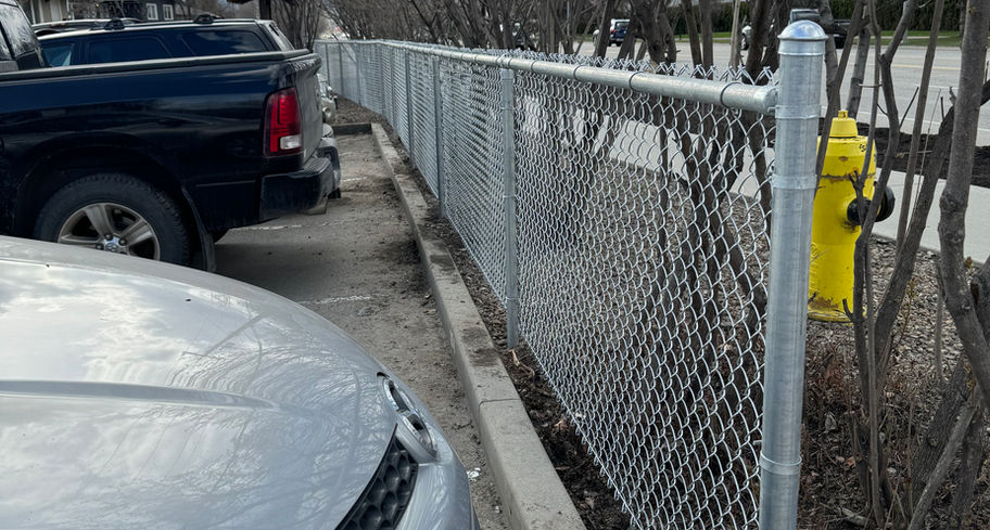 chain link barrier built around a parking lot at a vernon bc apartment complex 