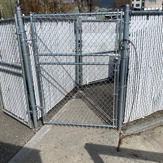 custom chain link gate for industrial yard automated and built by blue rhino fence in vernon bc