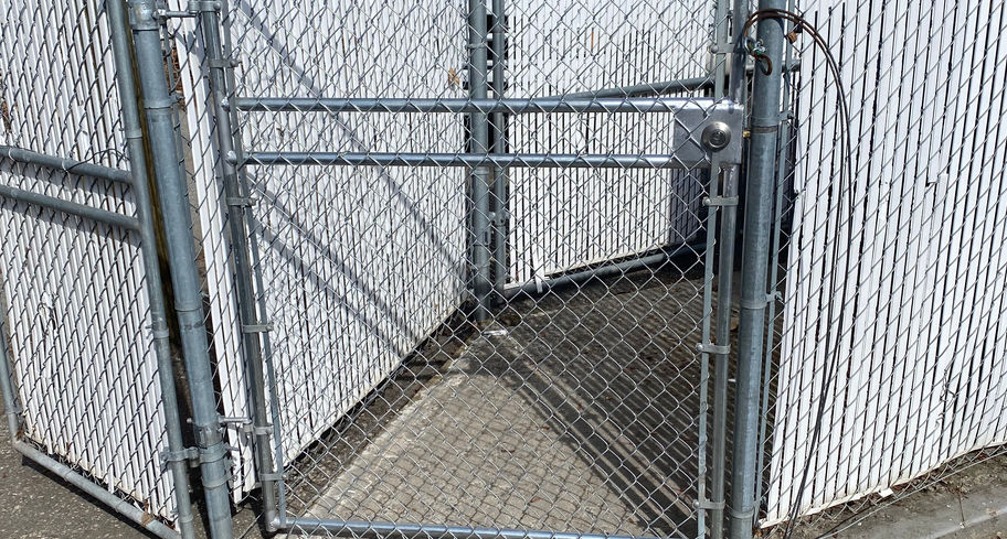 automated chain link gate for security built by blue rhino fence in vernon bc