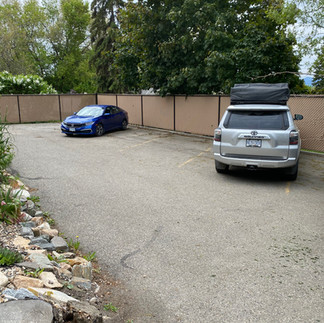 galvanized industrial chain link fence with beige privacy slats built by a professional commercial fence builder in vernon bc