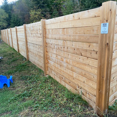 custom built treated wood fence for a vernon bc commercial property that needed privacy and security