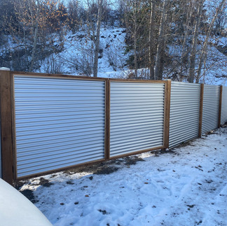 custom corrugated metal gate with wooden frame built for a commercial property in vernon bc