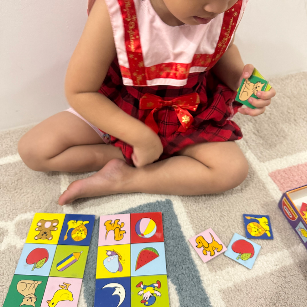 A child following instructions during speech and language therapy.