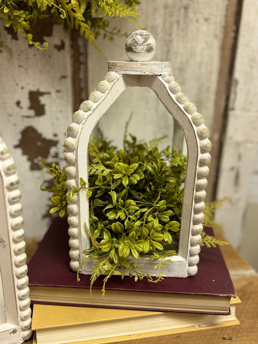 10.5” tall x 6” square, whitewashed wood beaded lantern, bell shaped, open air, wood ball finial on top