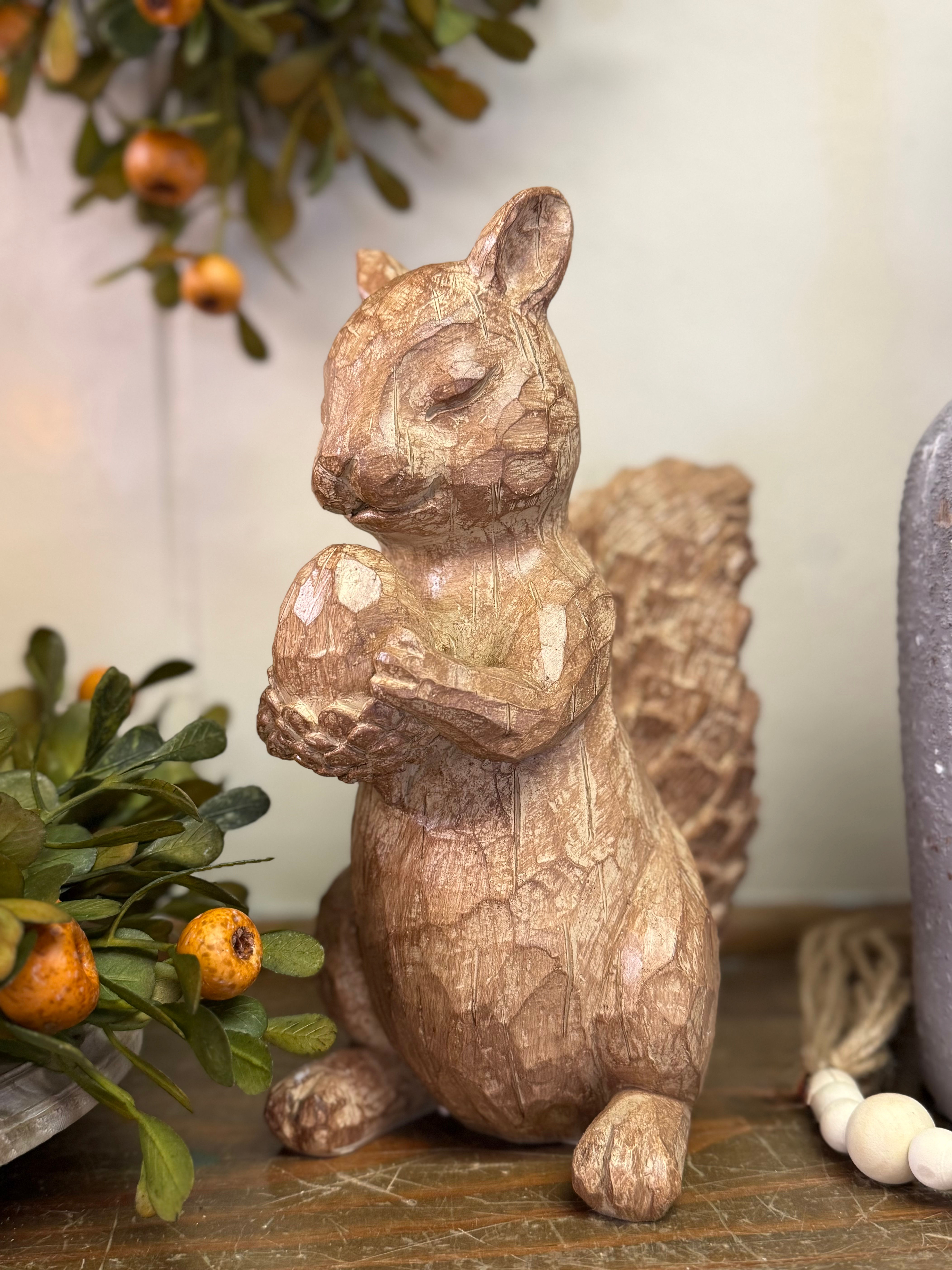 9" x 7.5" resin squirrel statue, looks like carved wood, standing holding an acorn, eyes closed as if praying grace