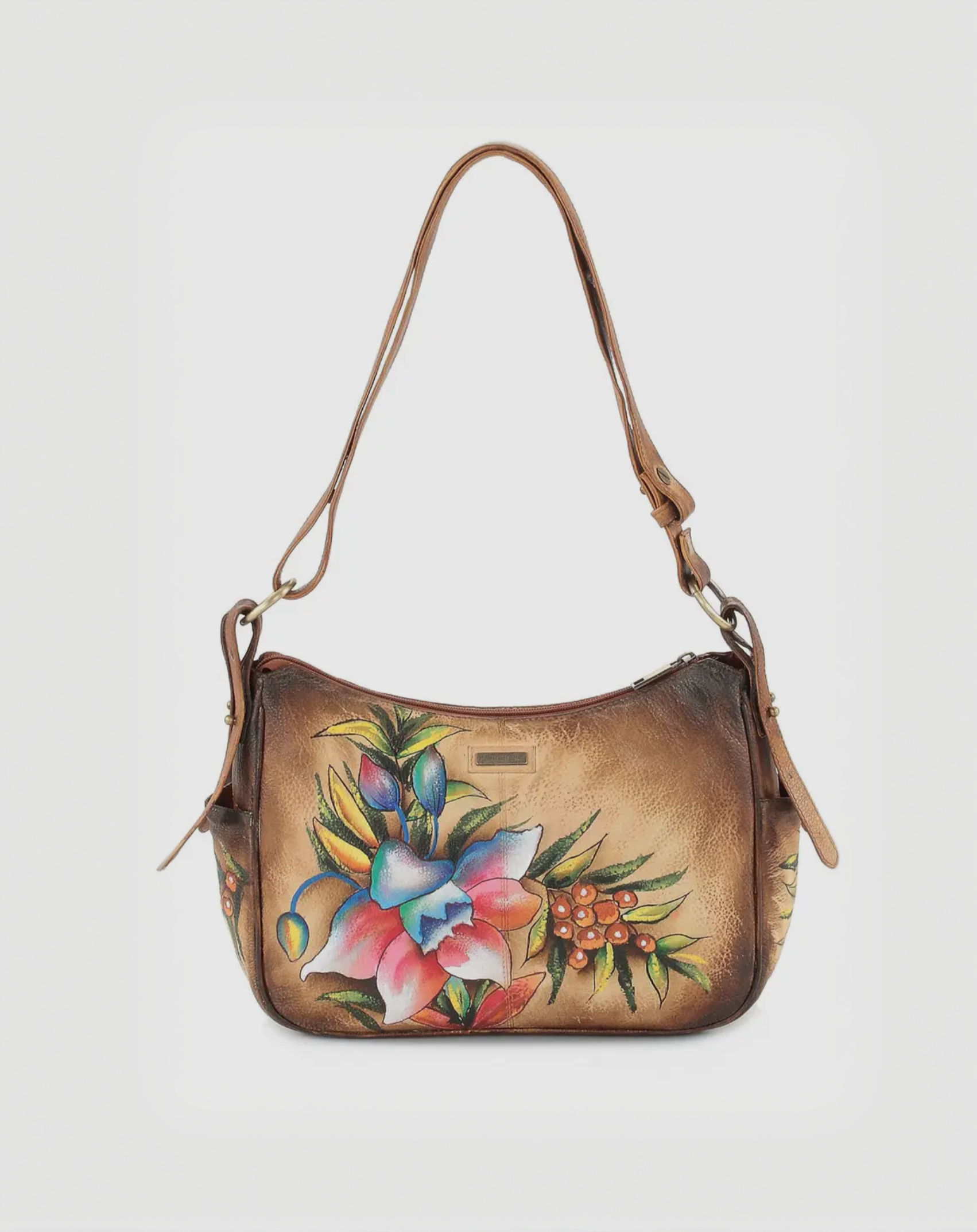 11"W x 8"H x 3.5"D hobo hand bag with an adjustable strap, soft grained calf leather, hand painted floral design, zipper top