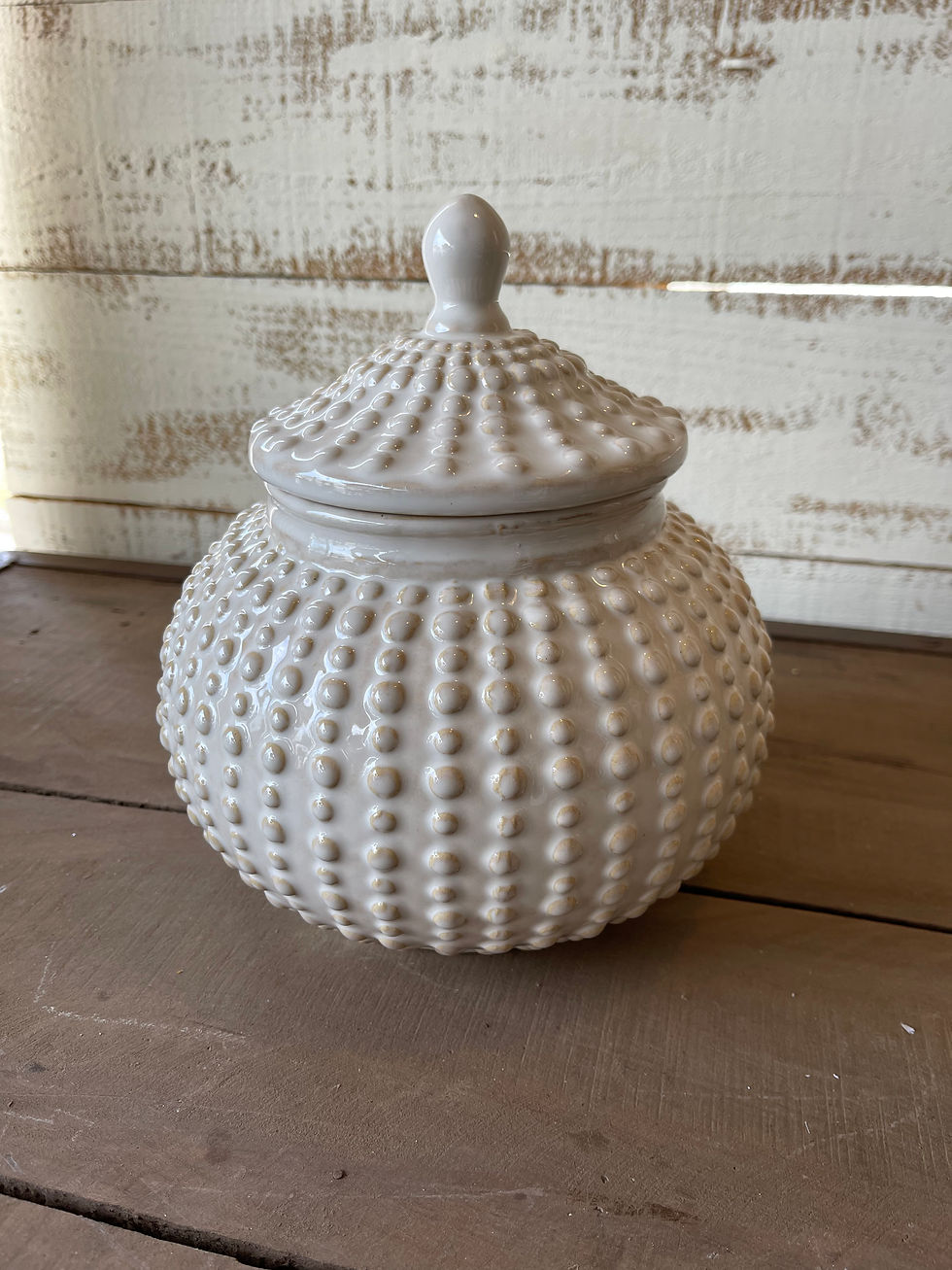 Cream Dotted Glazed ceramic Jar with lid. 7.75 x 9 in