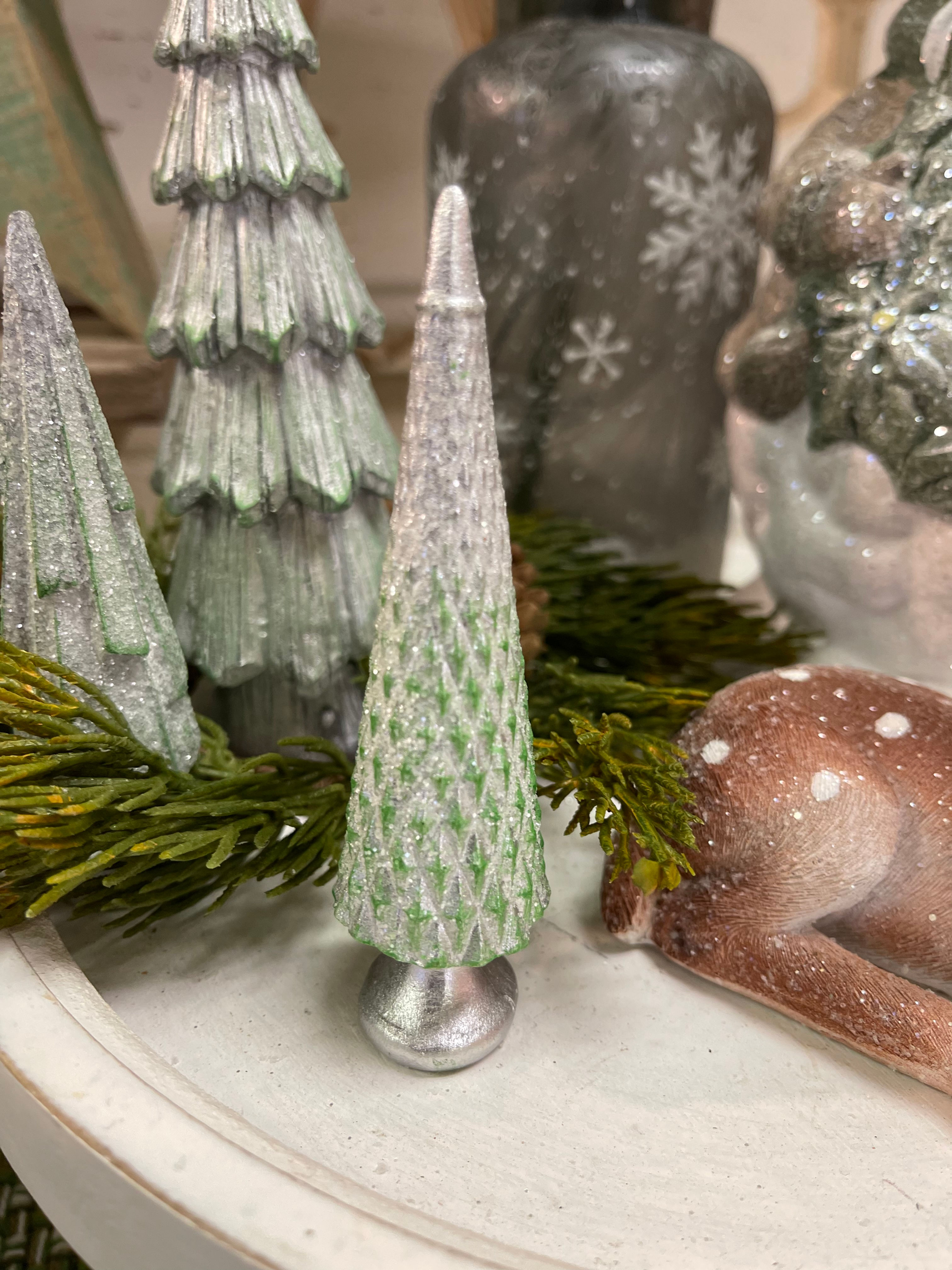 Green resin tree with a silver and sparkly snow overlay