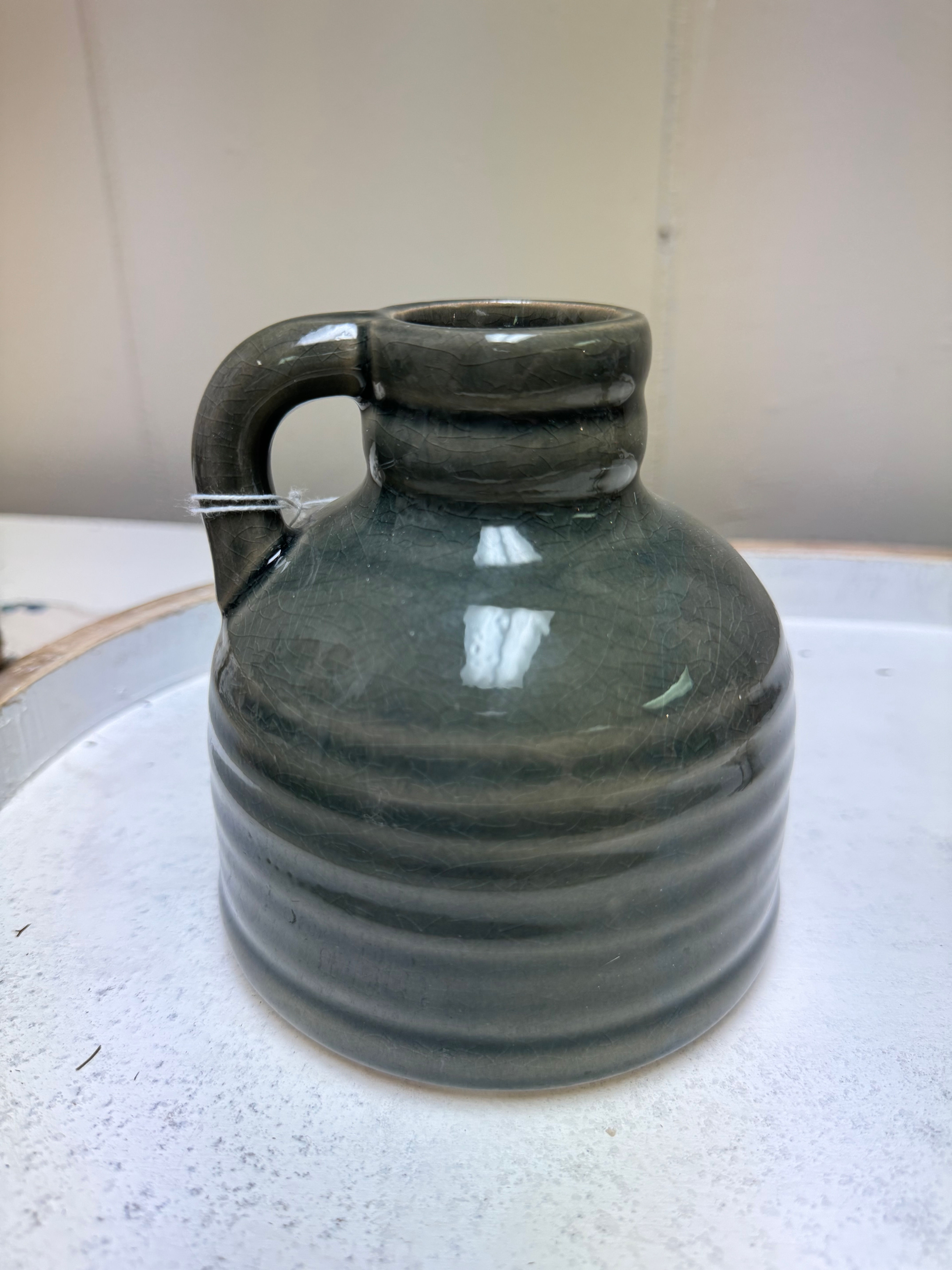 5”x4.75” small porcelain jug with slate gray crackled glaze, finger handle
