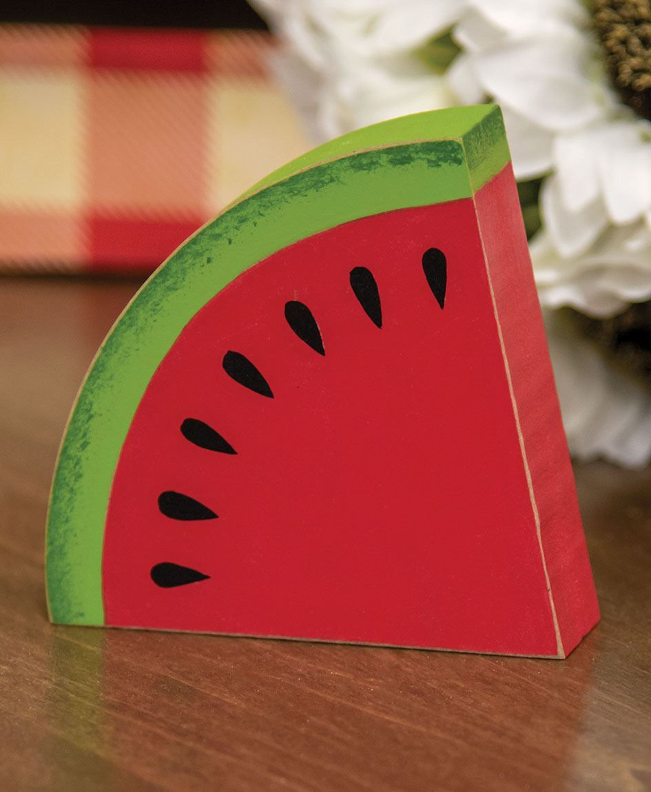 Wedge of wood painted to look like a watermelon slice