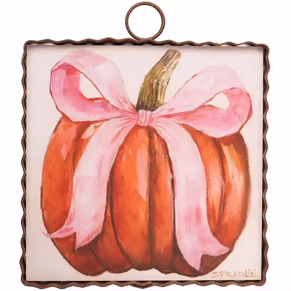6" x 1" x 7" Round Top Collection print of an orange pumpkin with a pink bow, corrugated metal frame, ring on top for hanging