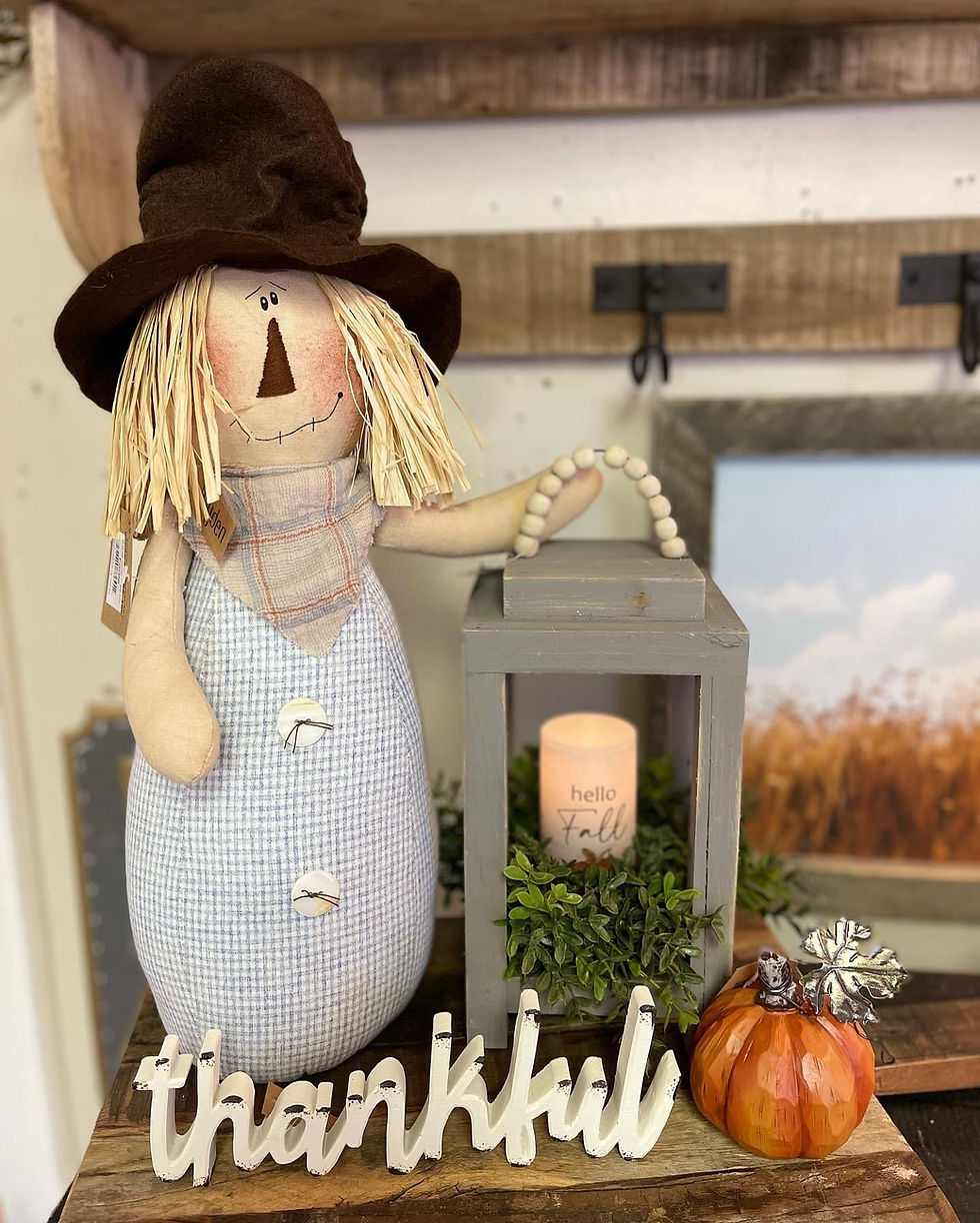 Thumbnail: Honey & Me 17"x7"  scarecrow doll has a light blue plaid fabric,  body, plaid neck kerchief, and brown felt top hat