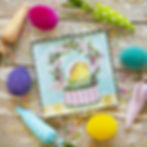 Round Top Collection charm printed with an Easter basket holding a chick in an egg