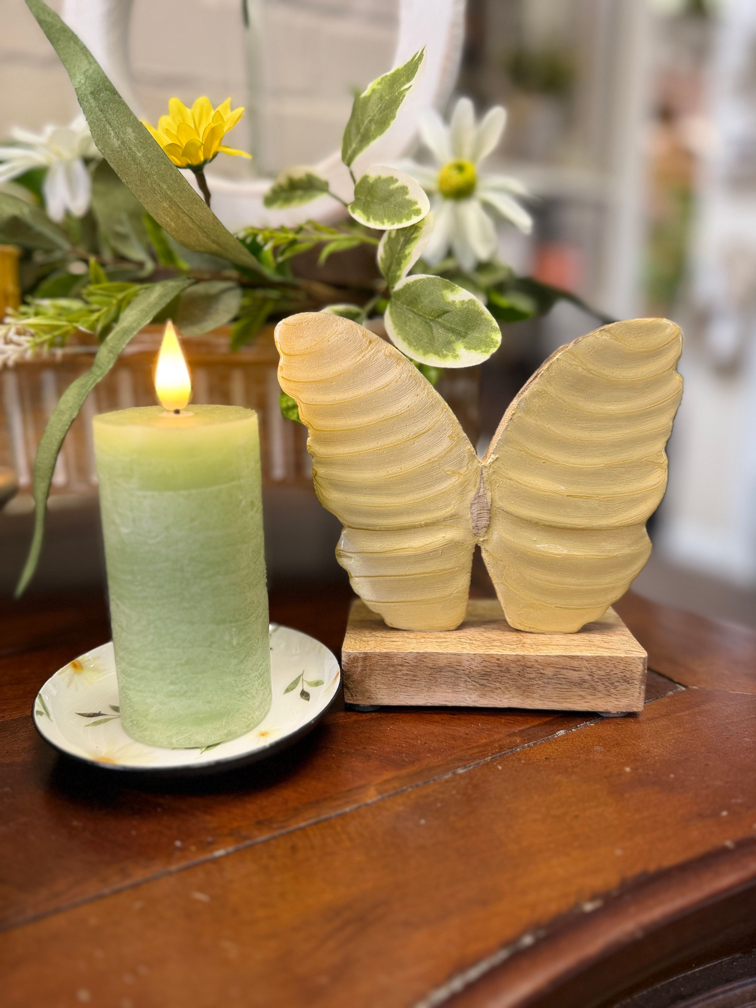 5" x 5.25" wood butterfly cutout on a wood base, freestanding, yellow enamel front on butterfly, tabletop sitter