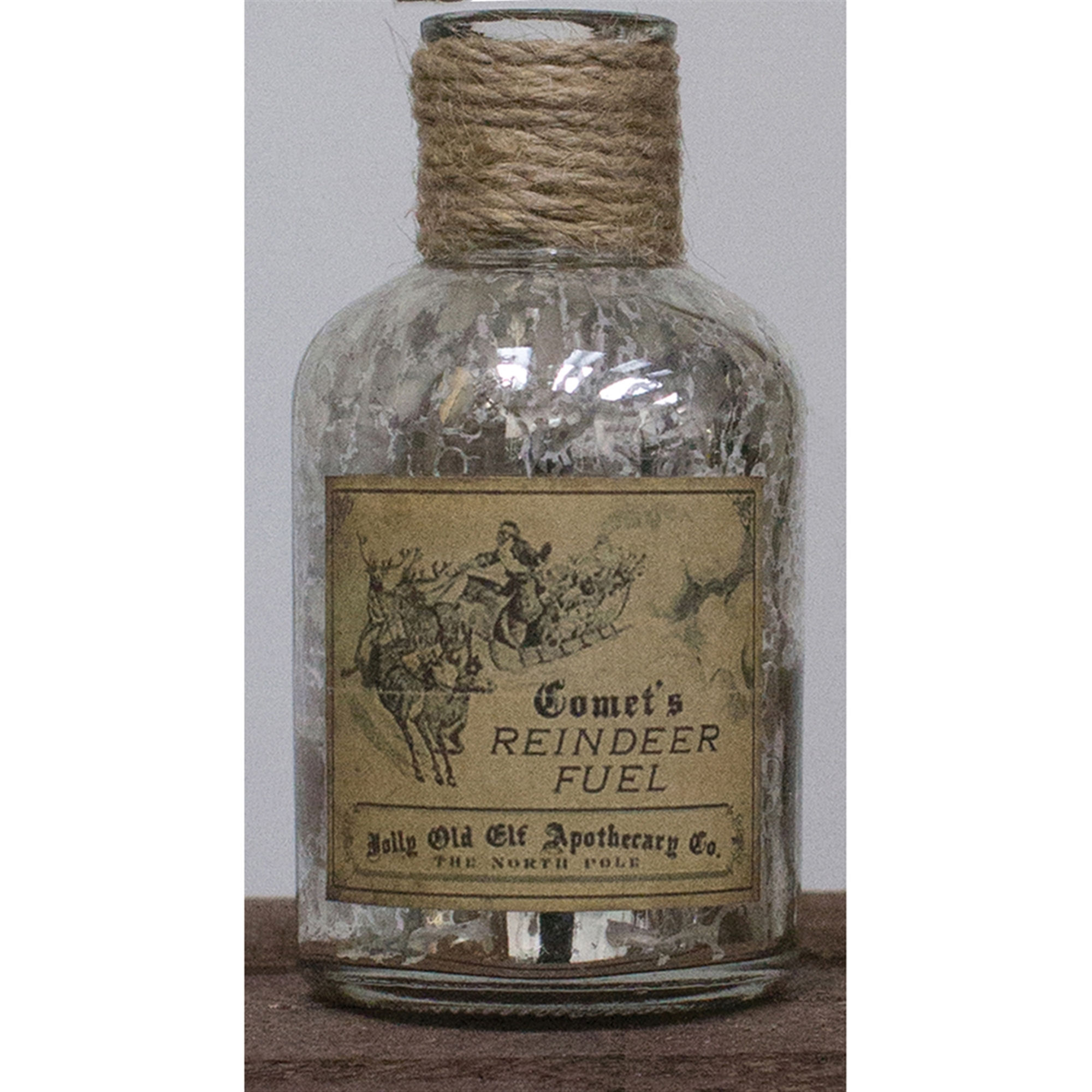 4.75" mercury glass bottle, jute wrapped neck, label says "Comet's reindeer fuel"