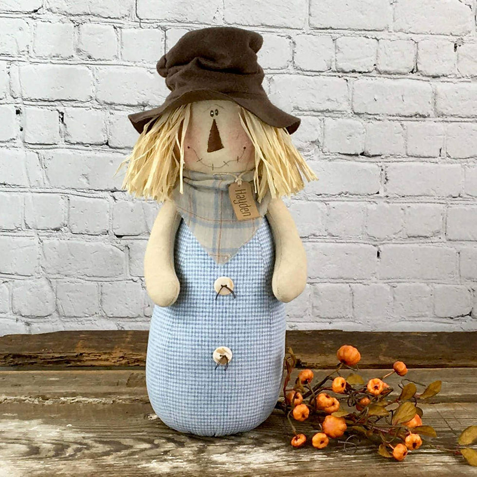 Thumbnail: Honey & Me 17"x7"  scarecrow doll has a light blue plaid fabric,  body, plaid neck kerchief, and brown felt top hat