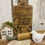 Thumbnail: 7.75” x 15.75 wood cutting board, hole in handle, carved wheat design & “give us this day our daily bread”, for display only