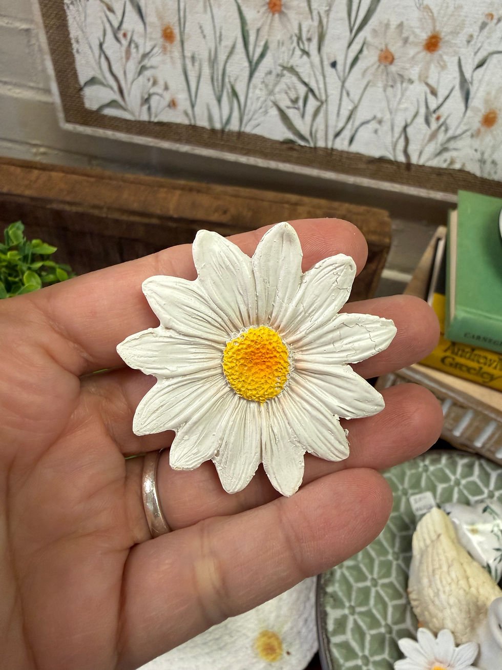 Thumbnail: 2" diameter resin white daisy with a yellow center, use as tray filler or table top accessory