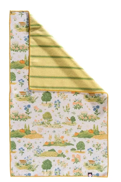 Reversible country garden kitchen towel with pumpkins, flowers, trees and bunnies and a coordinating green striped reverse.