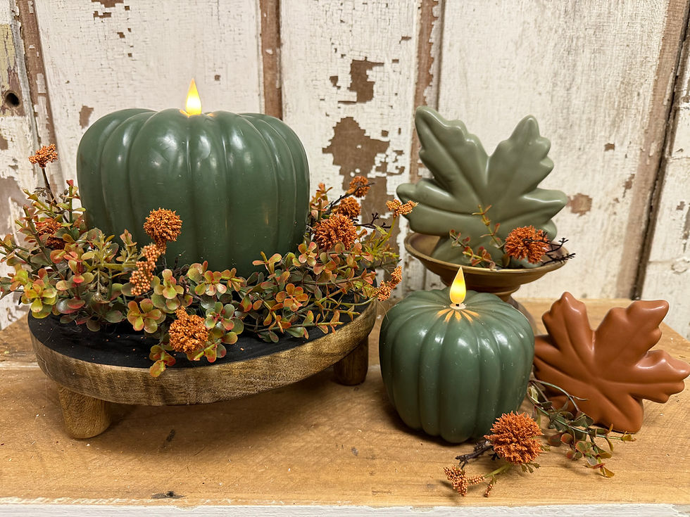 4" green wax pumpkin shaped LED candle, real look flame, 6 hr timer, 2 AAA batteries required (sold separately)