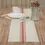 Thumbnail: 36" x 13" cotton weave slub fabric runner, cream with red, blue & gray thin stripes, red grain sack stripe appliqued center