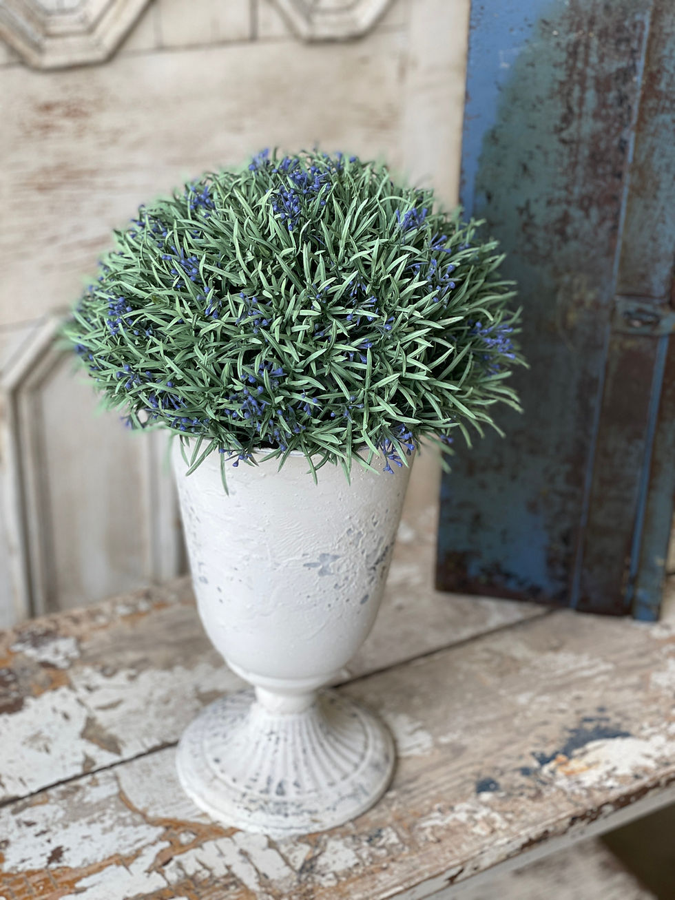 12” diameter half sphere 6.5” tall sprigs of purple/blue berries that top needle like green foliage