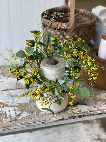 4.5” inner diameter, 10” outer diameter, candle ring of silver dollar eucalyptus, yellow mini bubble berries, asparagus fern