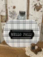 Large wood pumpkin in white and black plaid accented with galvanized stem and leaf. 12" tall x 12" wide x 1” deep