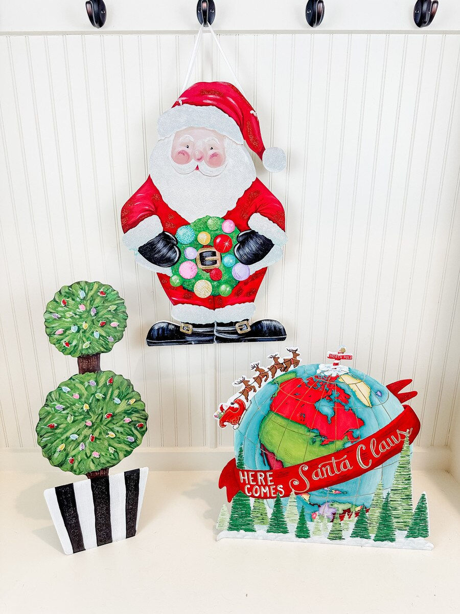 14" x 22" Round Top Collection PVC door hanger, Santa Claus holding a wreath