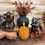 Thumbnail: 3" x 5" caramel colored wax candle, pine cone shaped, 6 hour automatic timer, uses included disc battery, fall decor