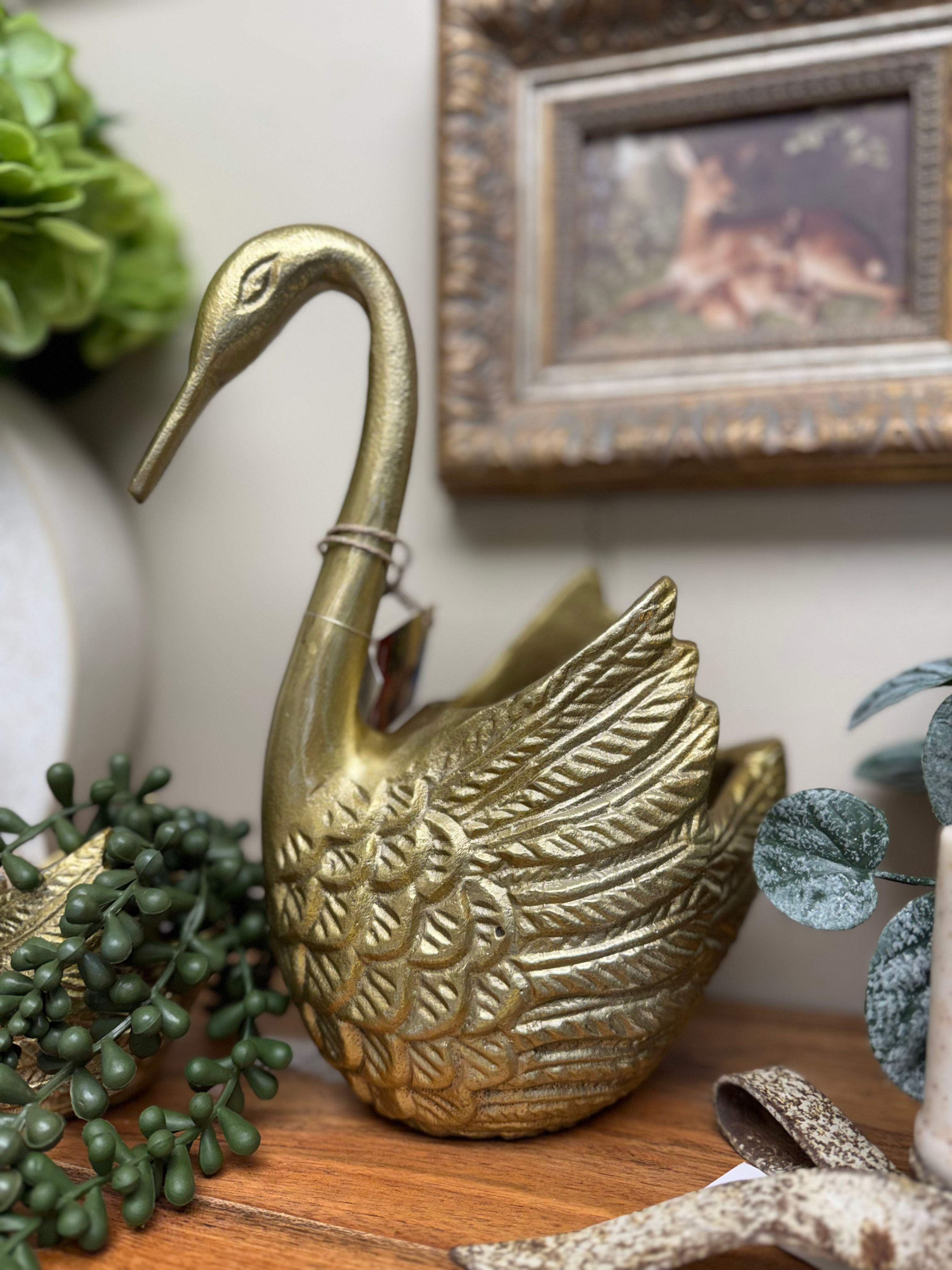 10" x 8" metal swan with gold finish, planter in swan back, looks like brass