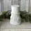 Thumbnail: 4.5" x 4.85" resin candle holder, white distressed finish, raised acanthus design, use for pillar candles or half spheres
