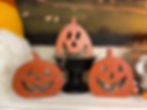 3 assorted sizes ranging from 4.33” to 3.9” orange wood block pumpkin with carved faces