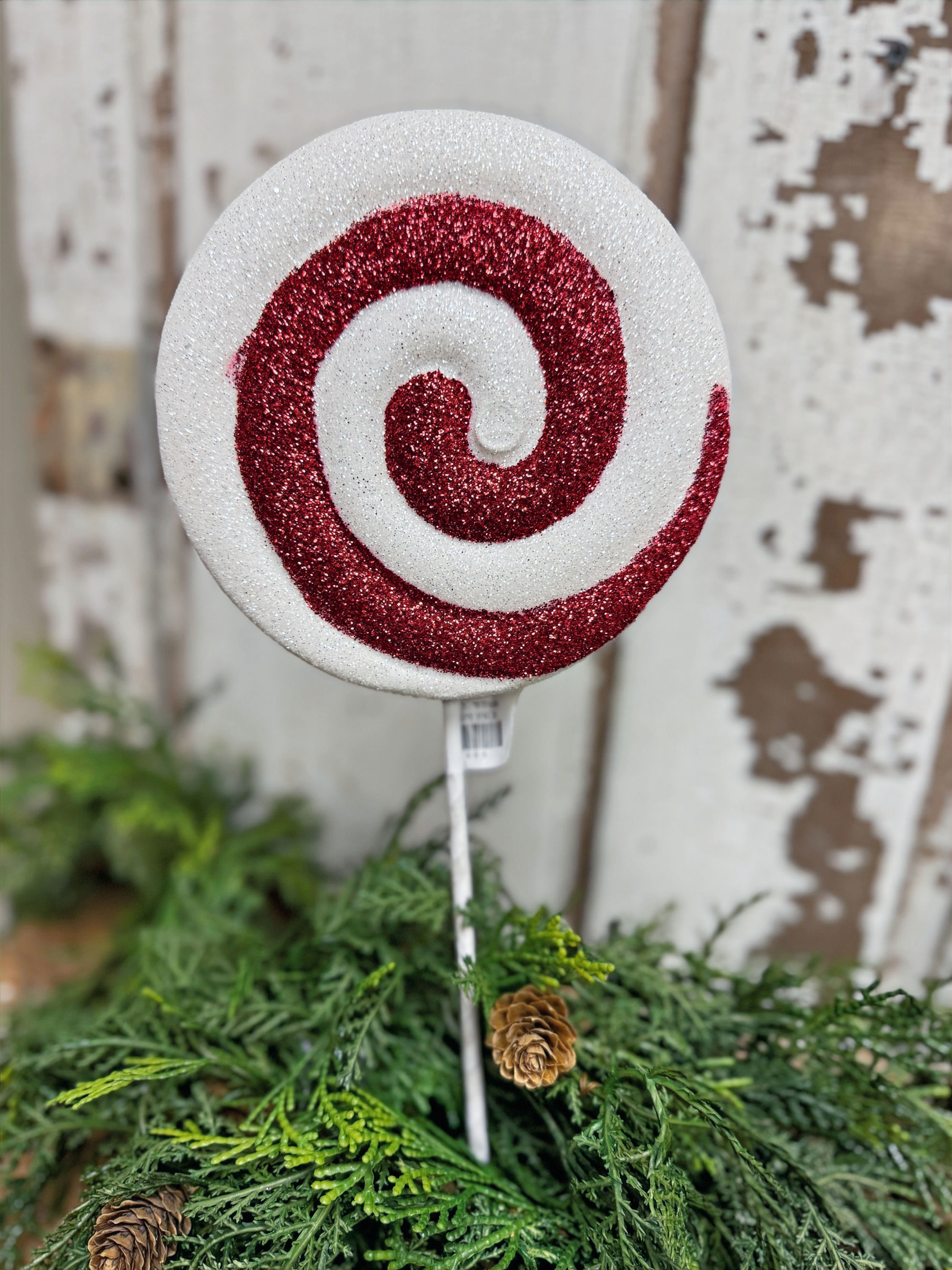 15" tall pick with a red and white swirl candy disc, use for holiday arrangements, wreaths & Christmas tree decor