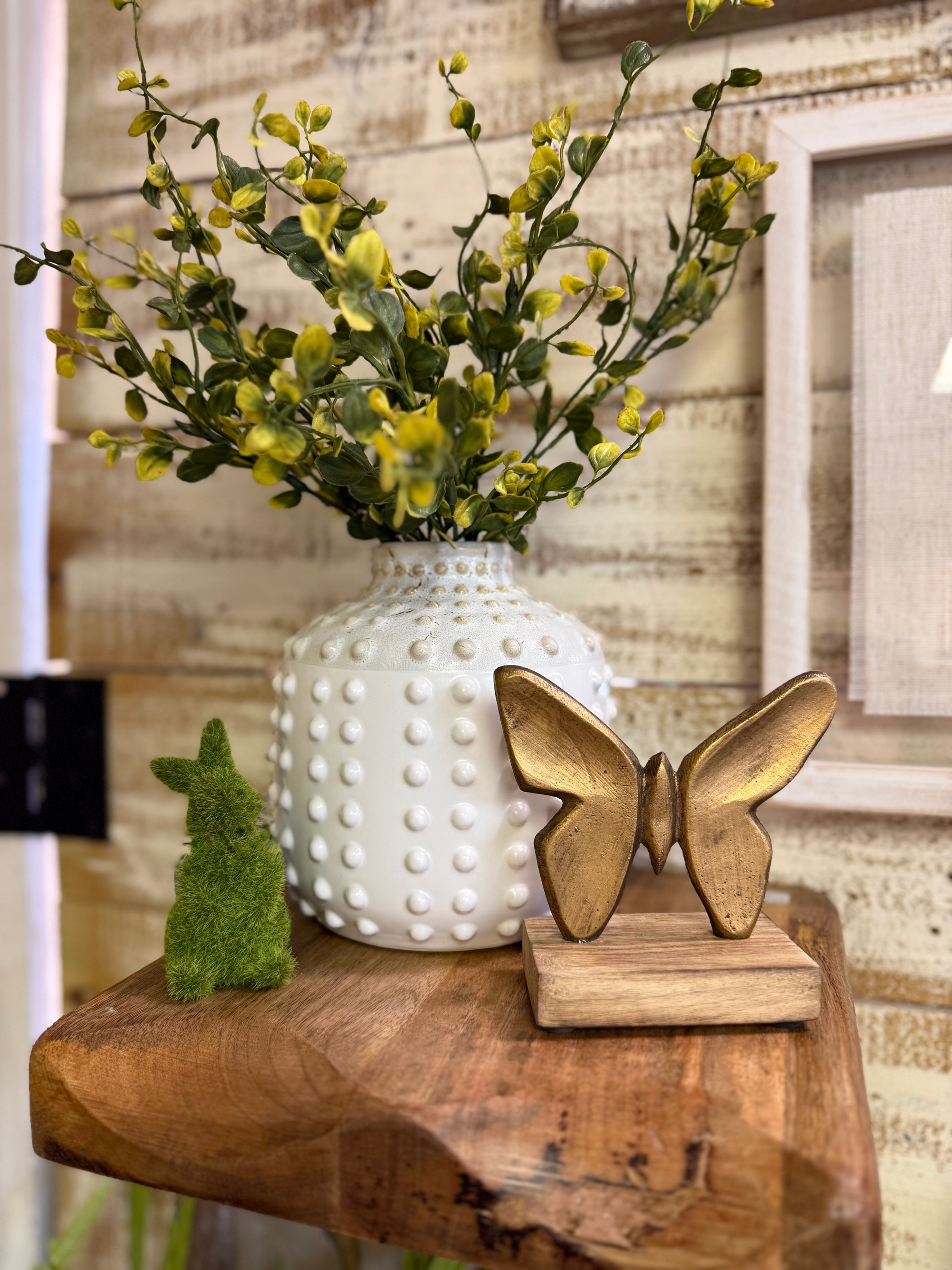 4.5" x 4.75" metal butterfly on a wood stand, butterfly has soft gold finish, tabletop decor
