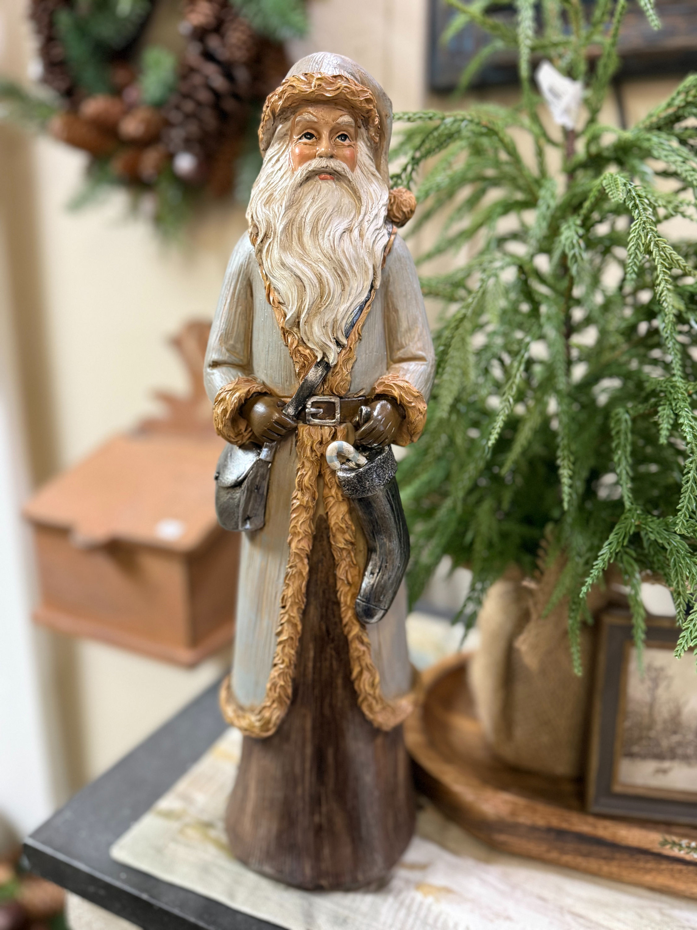17 inch resin Woodland Santa figurine dressed in soft neutral and brown tones with rustic Christmas details.
