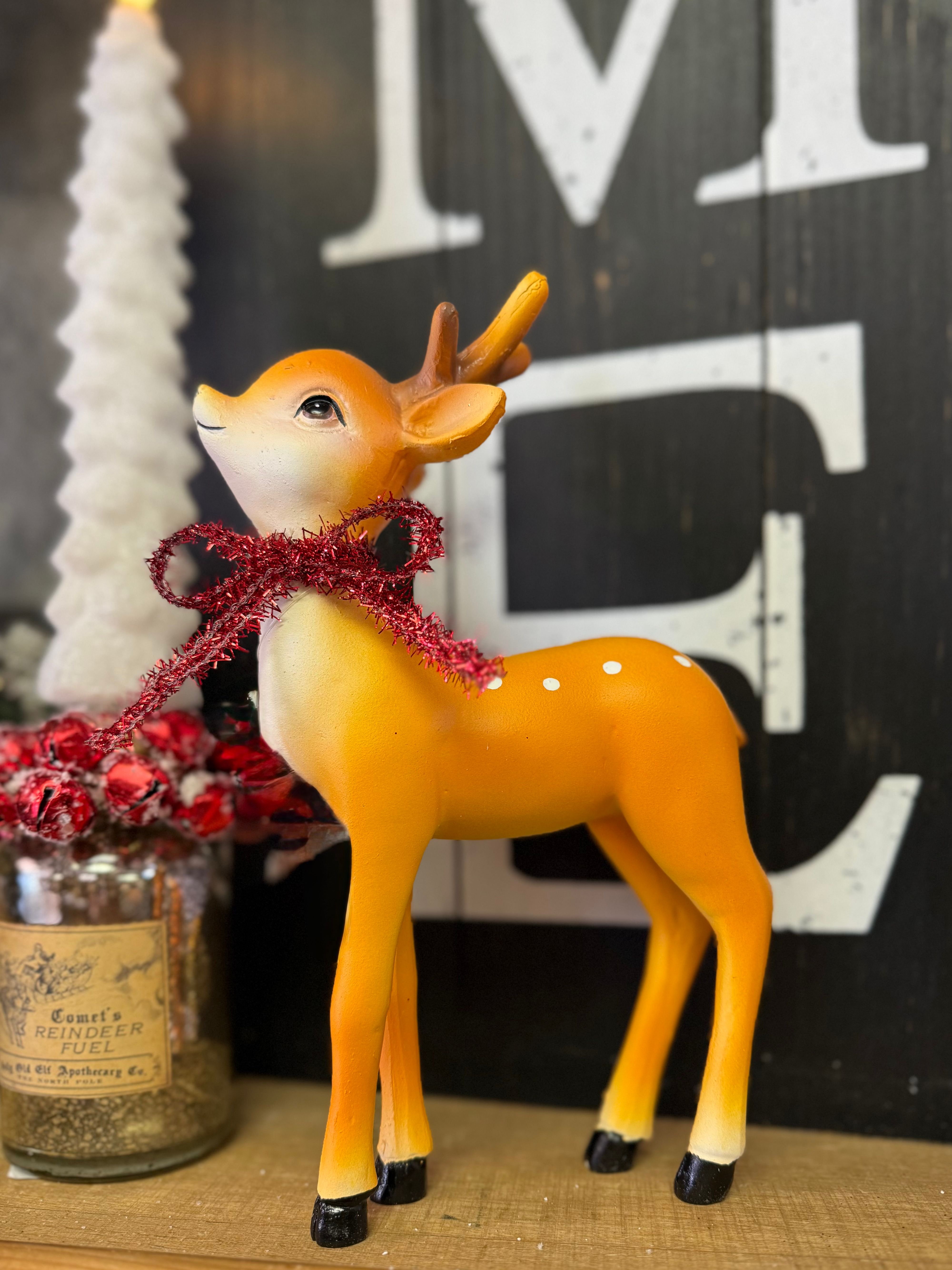 5.5" x 9" resin standing baby deer in a retro tan color with antlers and white spots