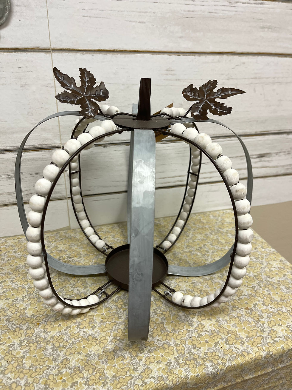 12.5"x12" Pumpkin form, alternating metal bands with white wood bead bands, pillar candle holder inside,metal stem & 2 leaves